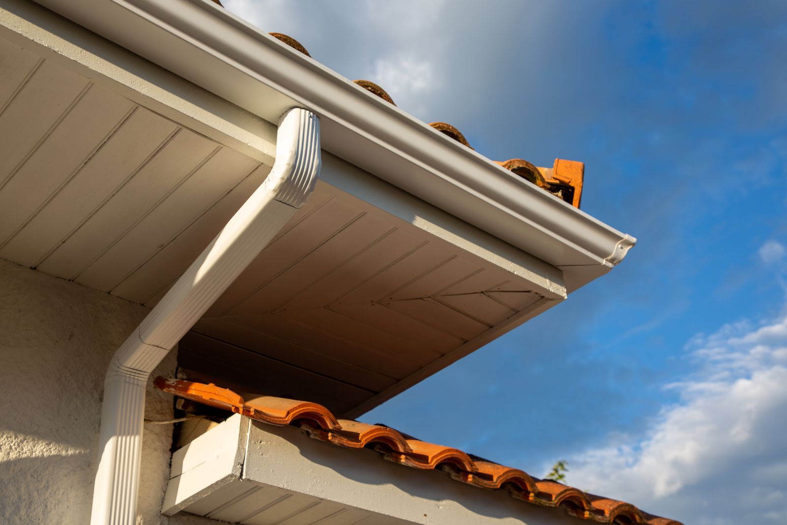 Roofer removing old shingles